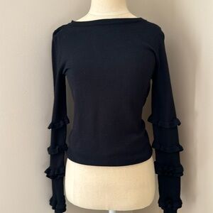 Black slight sweater shirt with ruffled sleeves great to dress up or down